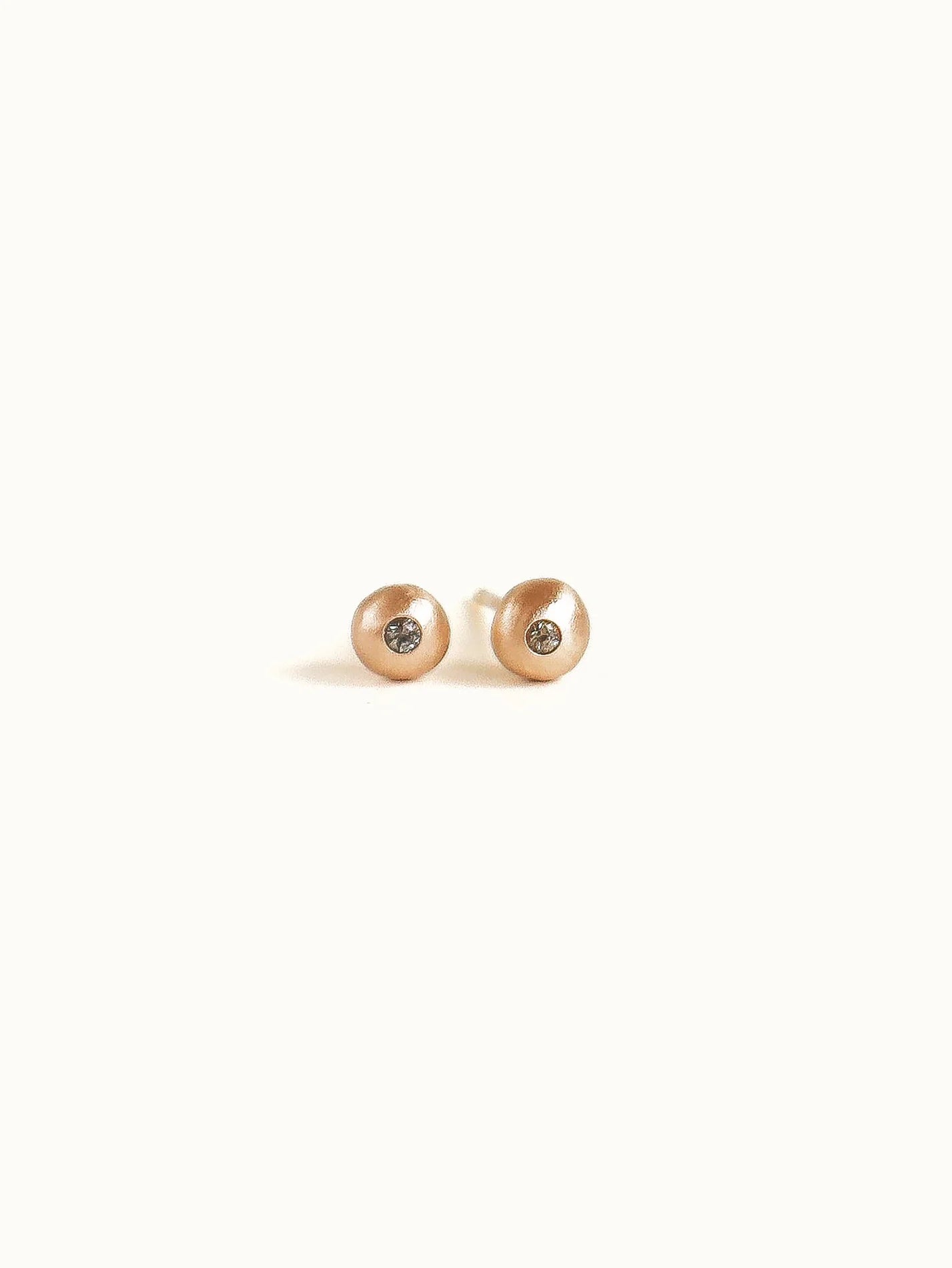 Pebble studs.  Pink champagne sapphire