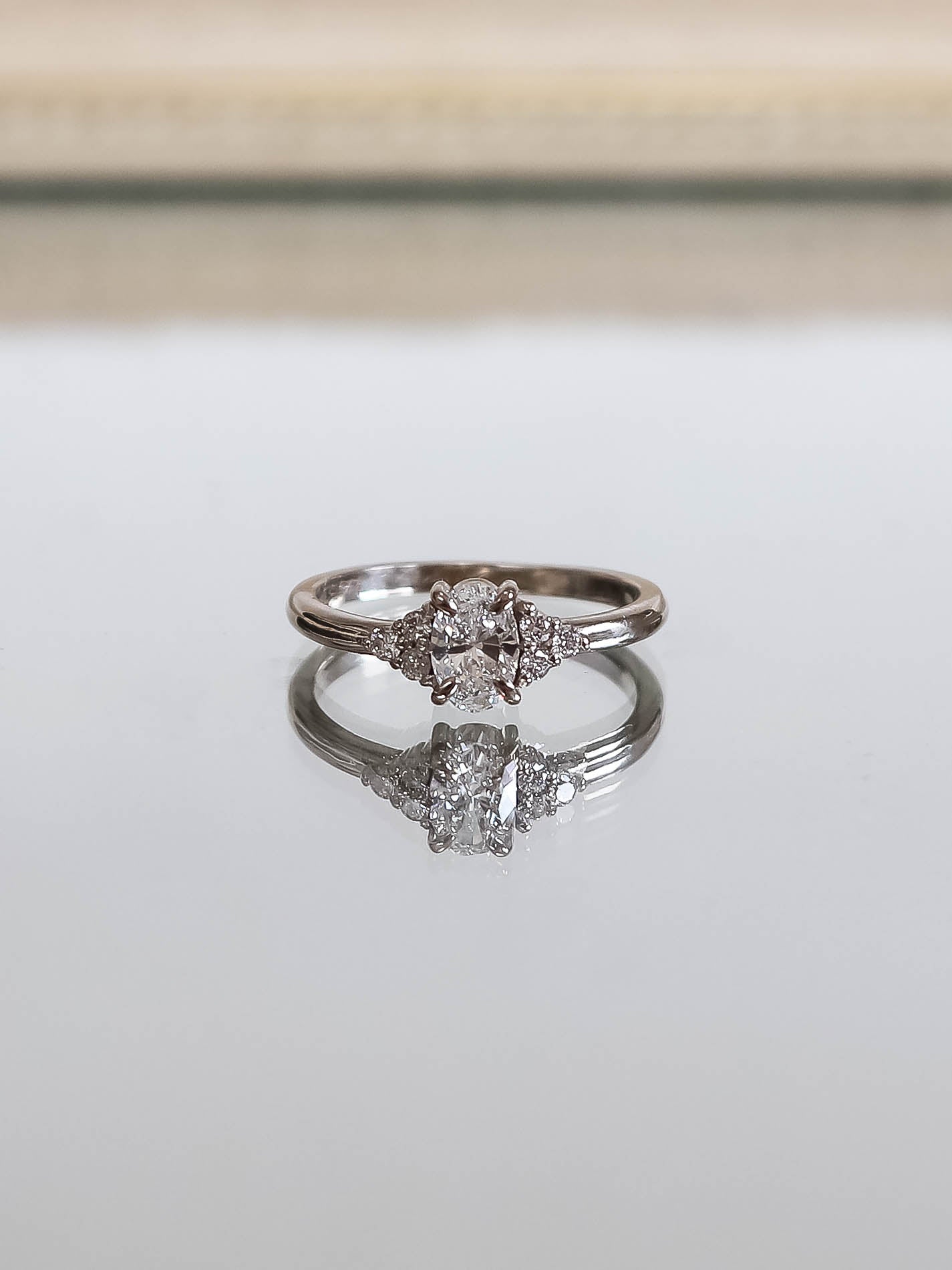 Camille. Oval diamond ring with diamond accents