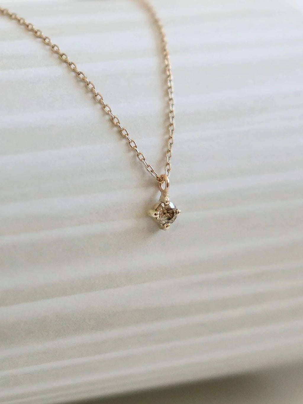 Champagne diamond solitaire