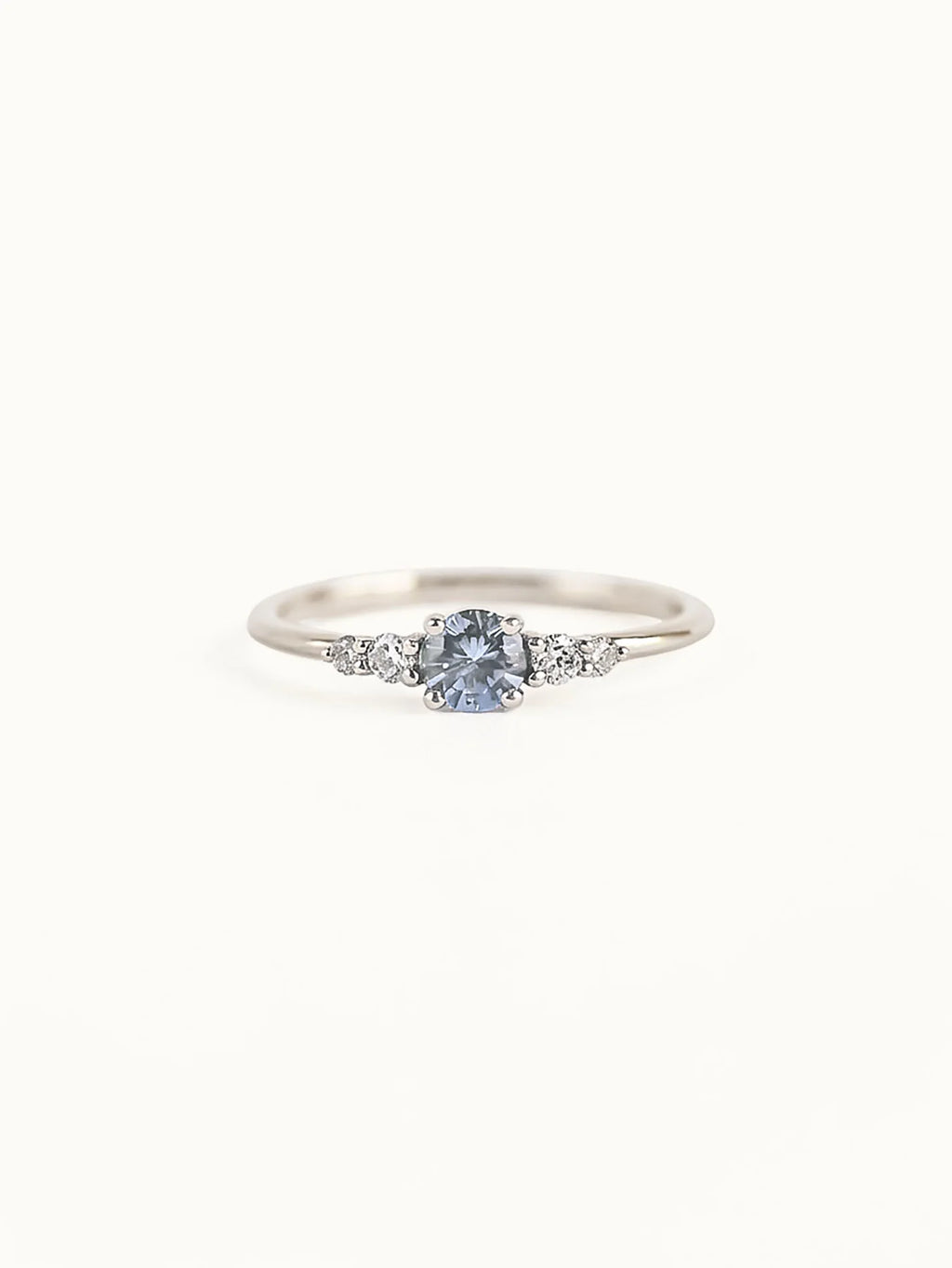 Frost sonnet. Light blue sapphire & diamonds