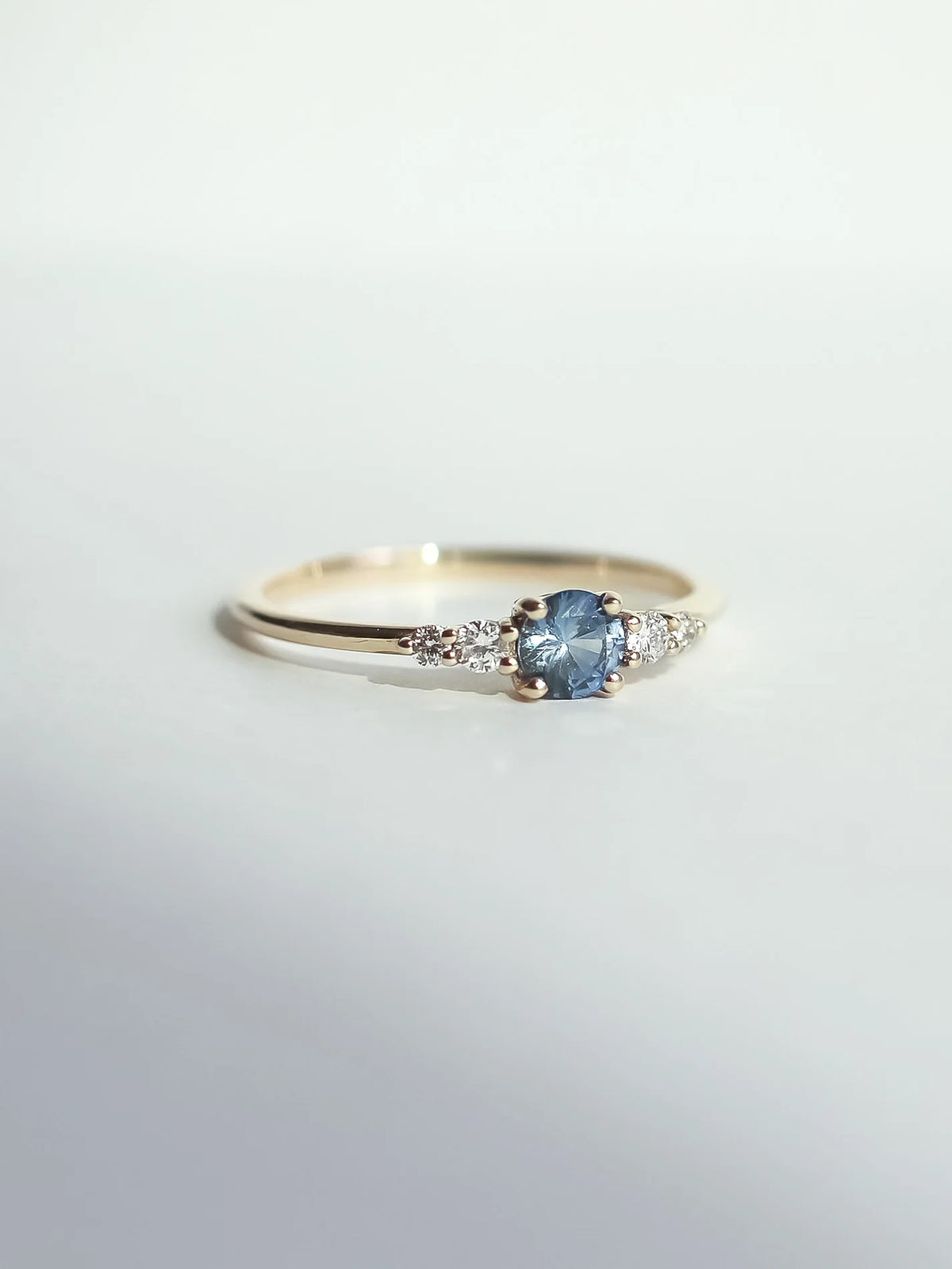 Frost sonnet. Light blue sapphire & diamonds