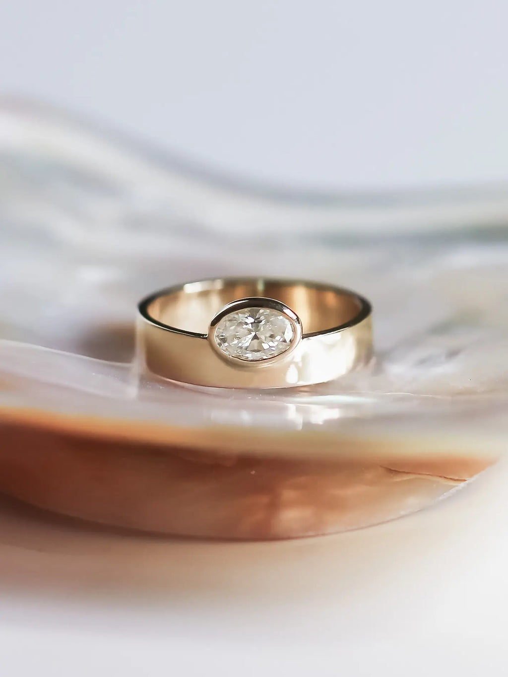 Gaia. Oval diamond bezel ring