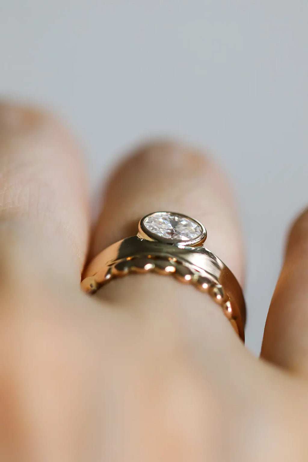 Gaia. Oval diamond bezel ring