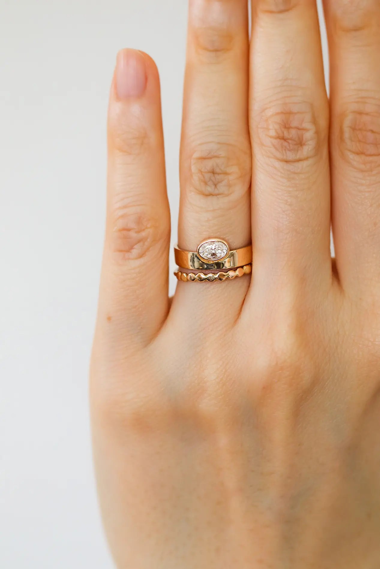Gaia. Oval diamond bezel ring