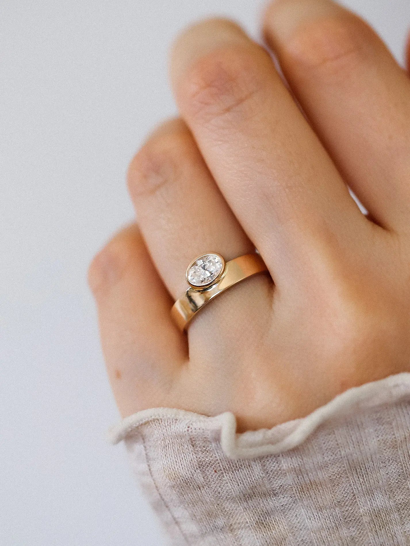 Gaia. Oval diamond bezel ring