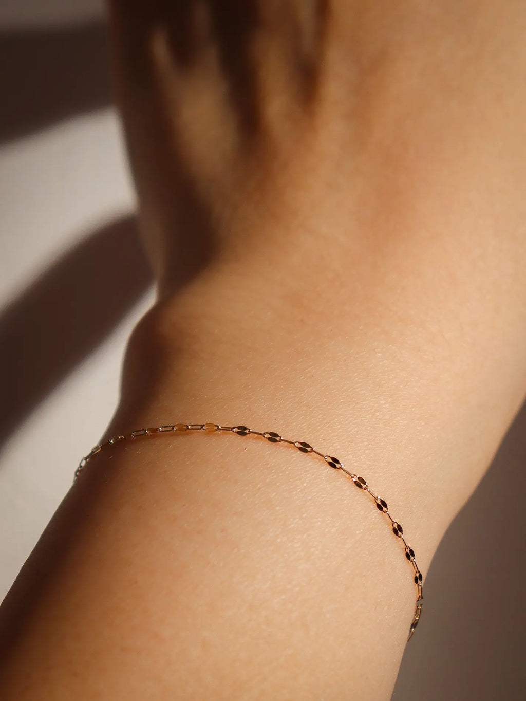 Moonlit Chain Bracelet in 10K yellow gold, polished mirror-finish links, delicate minimalist chain for layering or solo wear.