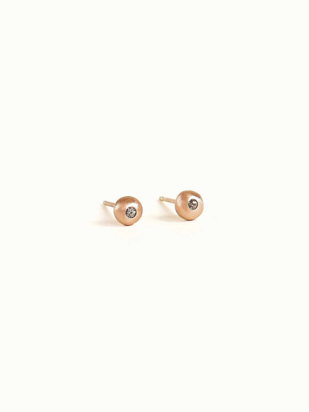 Pebble studs.  Pink champagne sapphire