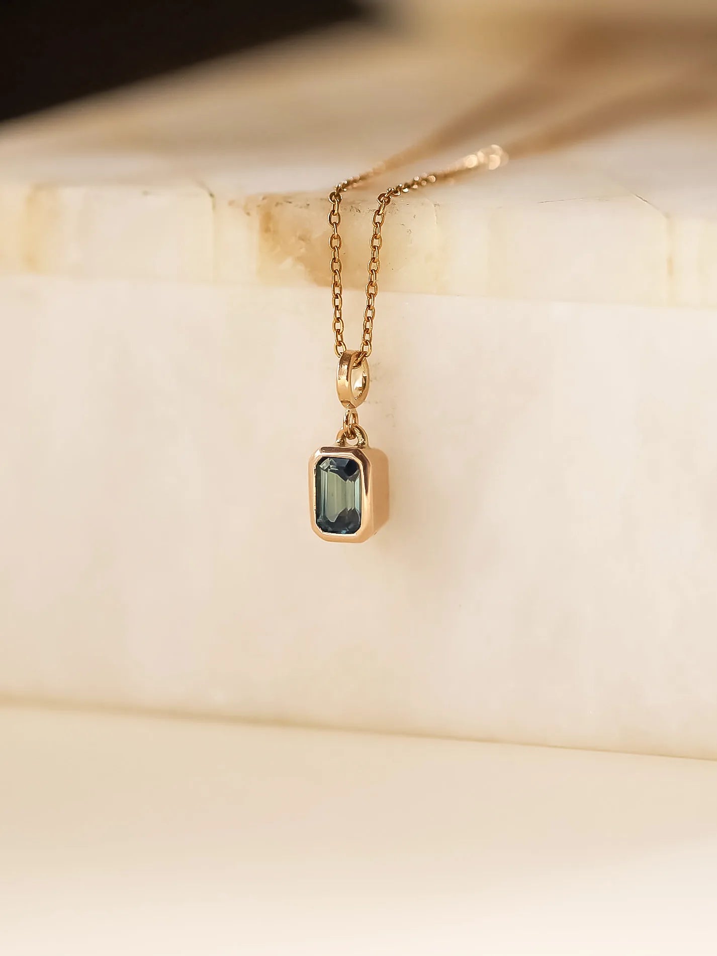 Rectangle step cut sapphire in Teal
