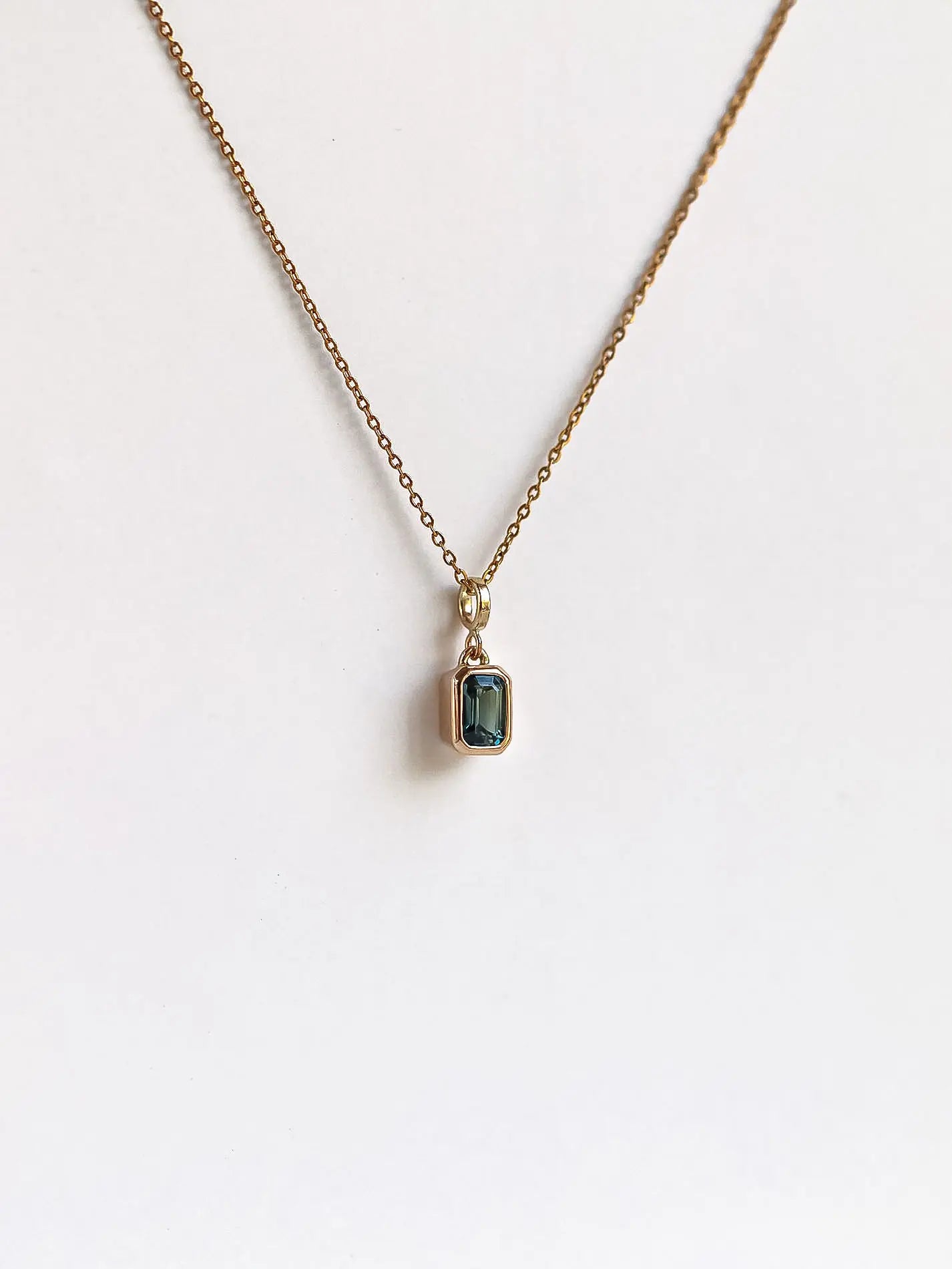 Rectangle step cut sapphire in Teal