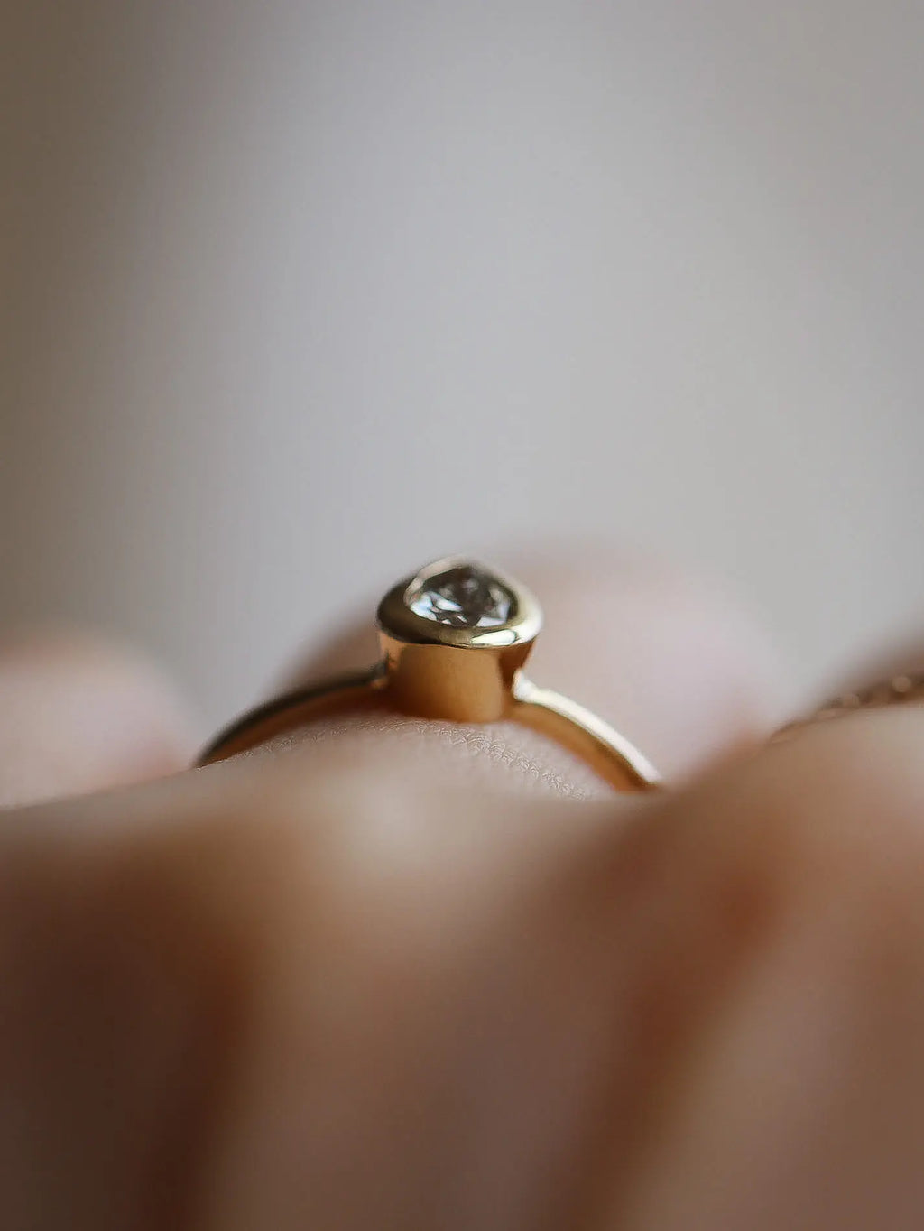 Ren. Natural pear diamond bezel setting. Ready-to-ship