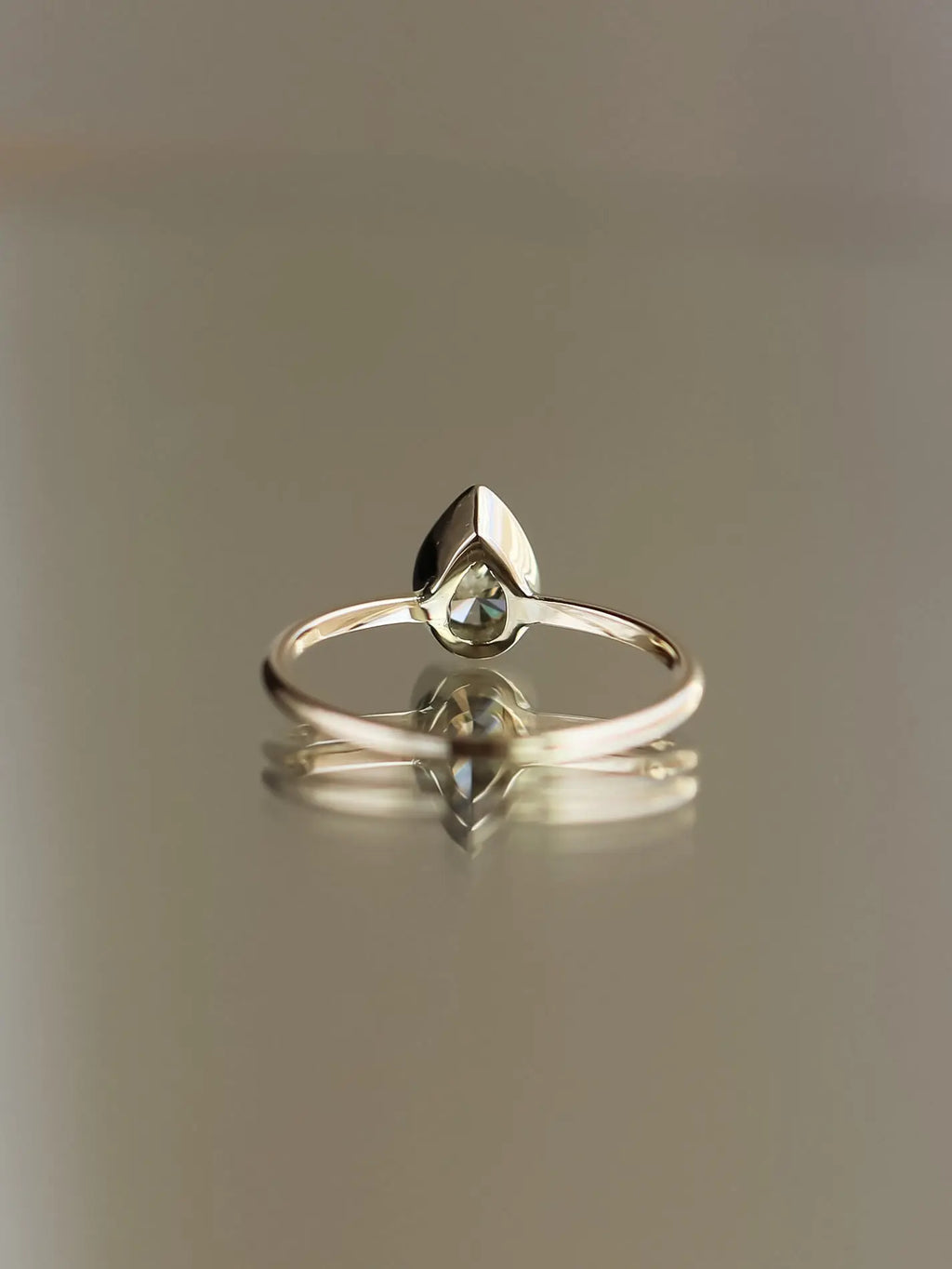 Ren. Natural pear diamond bezel setting. Ready-to-ship