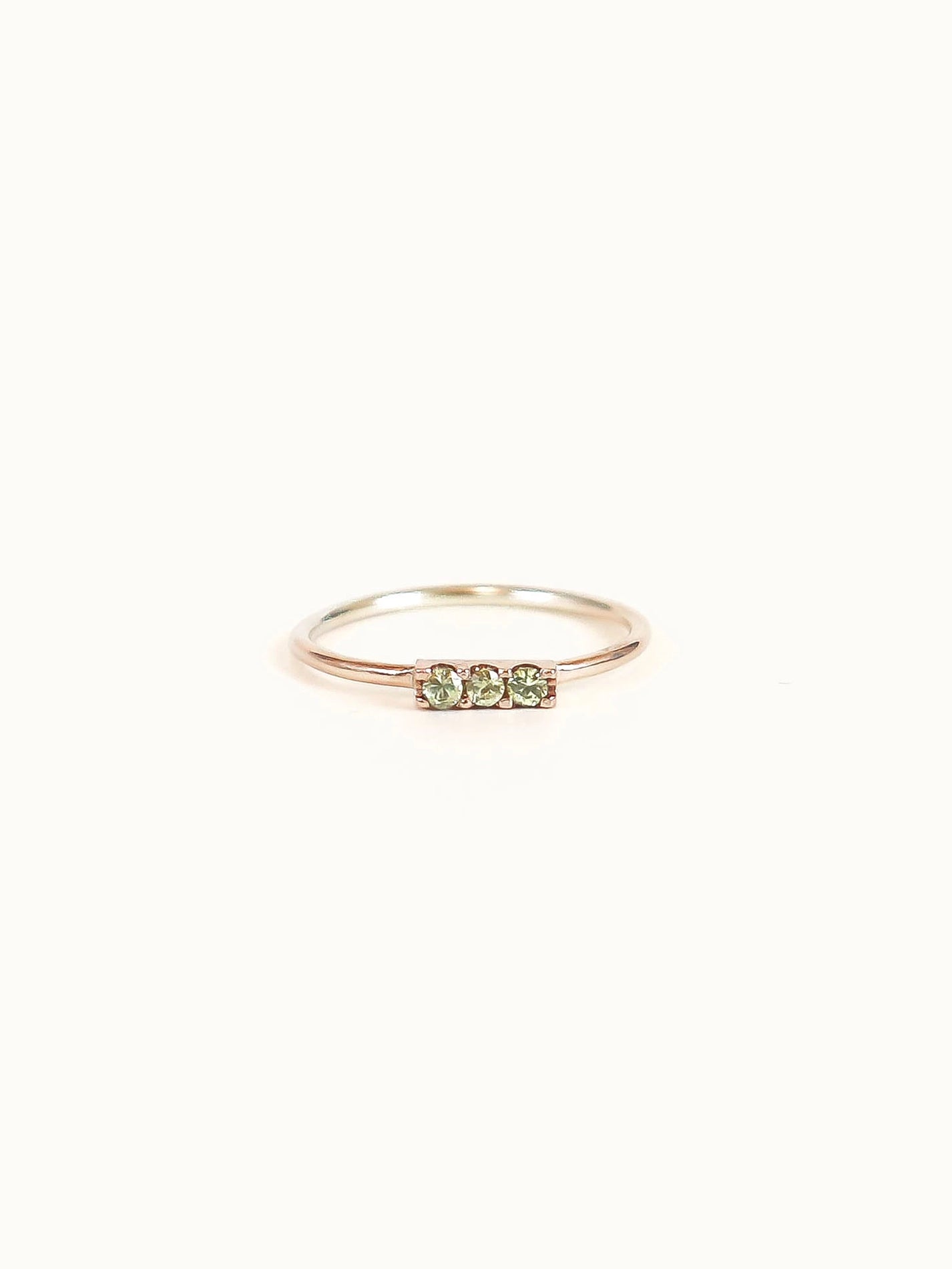 Green sapphire bar ring yellow gold